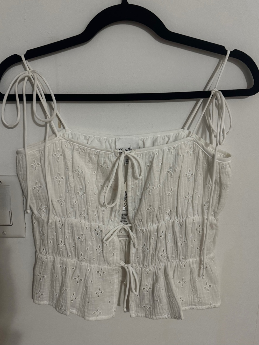 White eyelet tie-front peplum camisole
